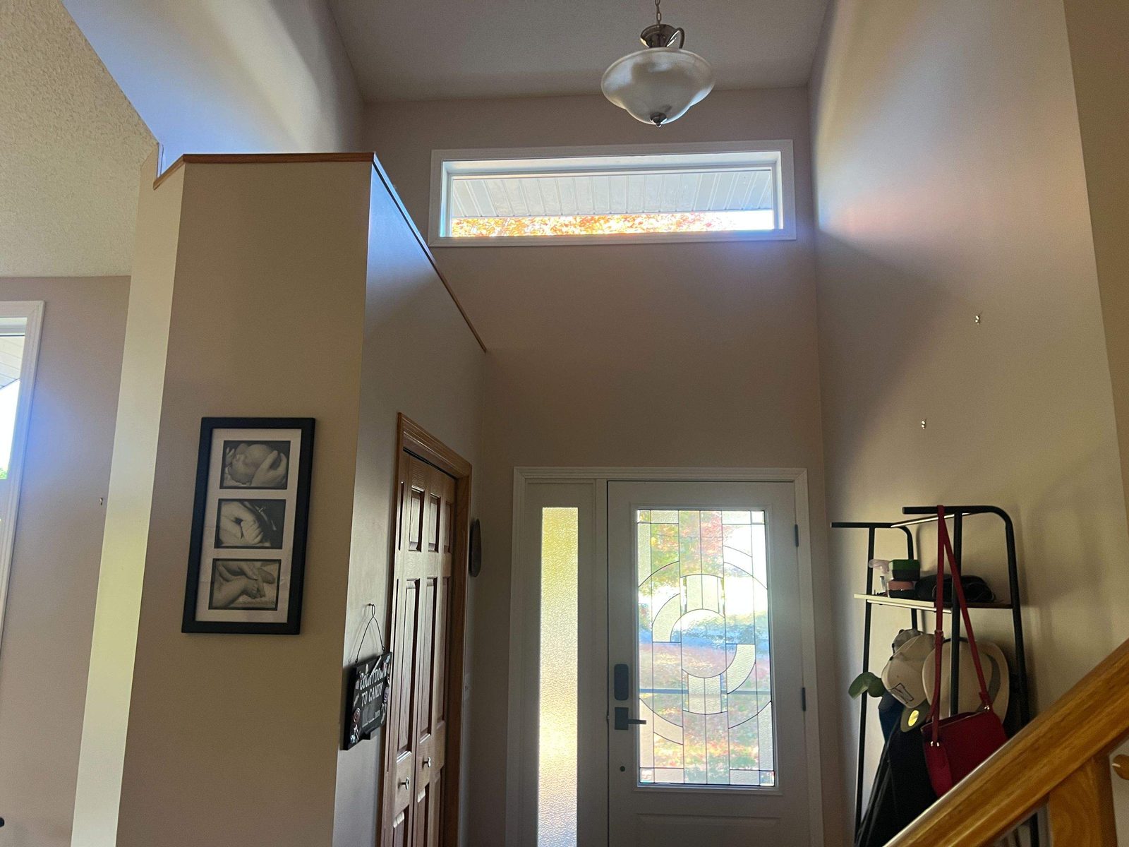Interior view of new entry door and transom window, St. Michael project